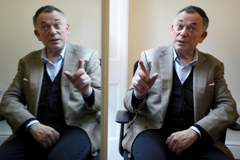 Businessman Ian Maxwell, brother of Ghislaine Maxwell is reflected in a mirror, during an interview at his office in London, Monday, Nov. 15, 2021. The brother of a British socialite charged with helping Jeffrey Epstein exploit underage girls says her prosecution is “the most over-hyped trial of the century,” designed to break a woman targeted by authorities desperate to blame someone for the late financier’s crimes. Ghislaine Maxwell continues to have the backing of her family, and a family member will be in court at all times to show their support, Ian Maxwell said in an interview ahead of the trial, which is set to begin Nov. 29 in U.S. District Court in Manhattan. (AP Photo/Kirsty Wigglesworth)