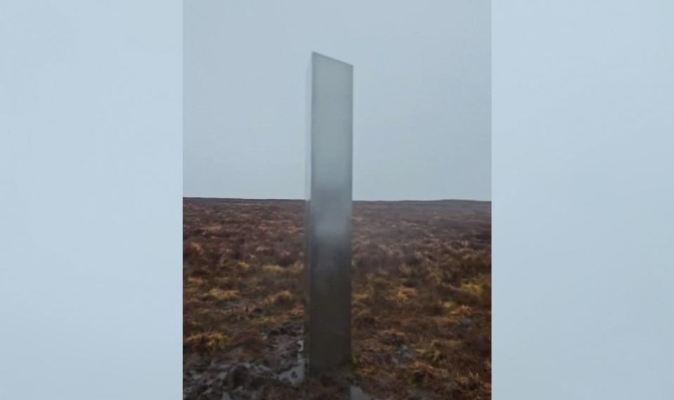 PHOTO: A mysterious, roughly 10-foot-tall silver metal monolith was discovered on a muddy bluff in Wales by hiker Craig Muir. (Craig Muir via Storyful)