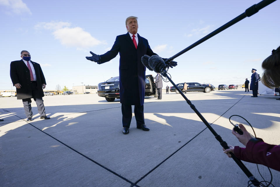 President Donald Trump speaks to reporters before a campaign rally at Green Bay Austin Straubel International Airport, Friday, Oct. 30, 2020, in Green Bay, Wis. (AP Photo/Alex Brandon)