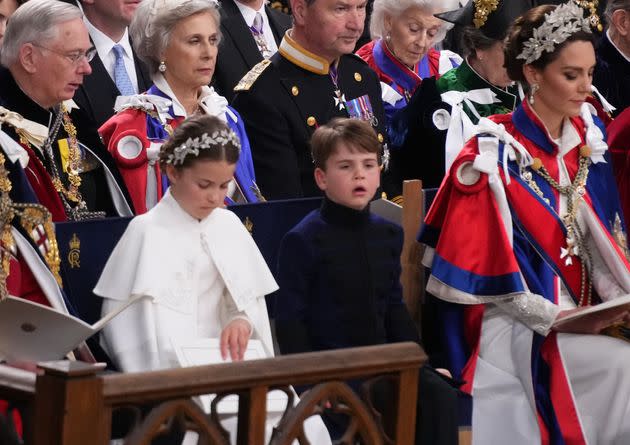 Prince Louis looks like he&#39;s struggling to concentrate as the service continues on.