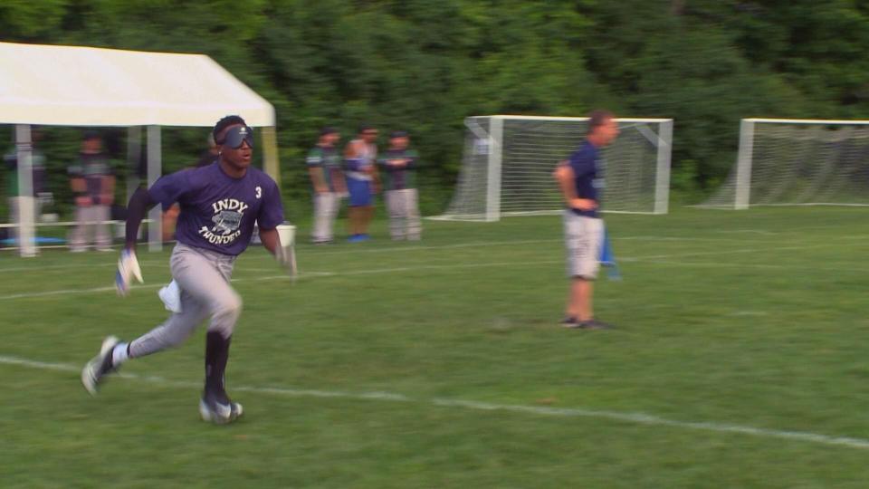 A beep baseball player dashes across the diamond blindfolded in "Thunder Rolls! The World of Blind Baseball."