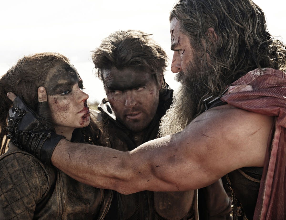 (L-R) Anya Taylor-Joy, Tom Burke, and Chris Hemsworth in <em>Furiosa</em><span class="copyright">Jasin Boland—Warner Bros.</span>