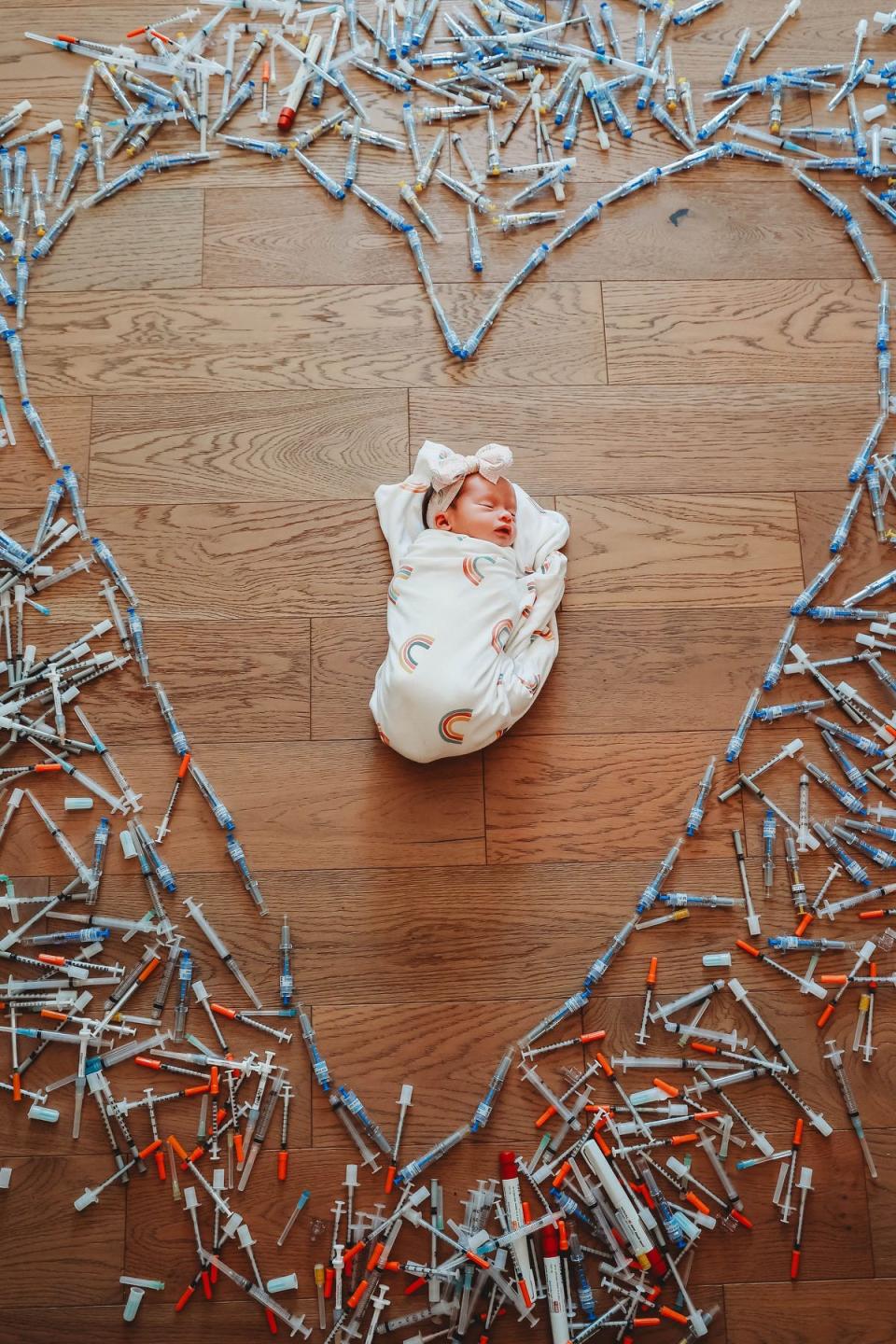 Our daughter surrounded by the hundreds of needles used during IVF.