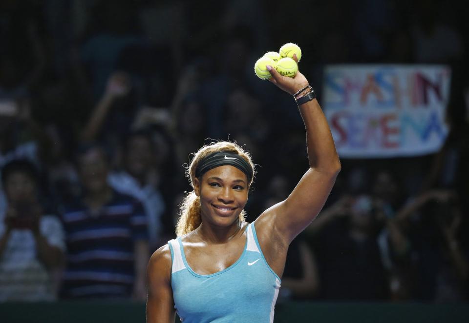 Williams of the U.S. celebrates her win over Wozniacki of Denmark during their WTA Finals singles semi-finals tennis match at the Singapore Indoor Stadium