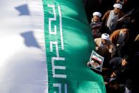 <p>Iranians take part during a state-organized rally against anti-government protests in the country, in Qom, Iran on Jan. 3, 2017. (Photo: Stringer/Anadolu Agency/Getty Images) </p>