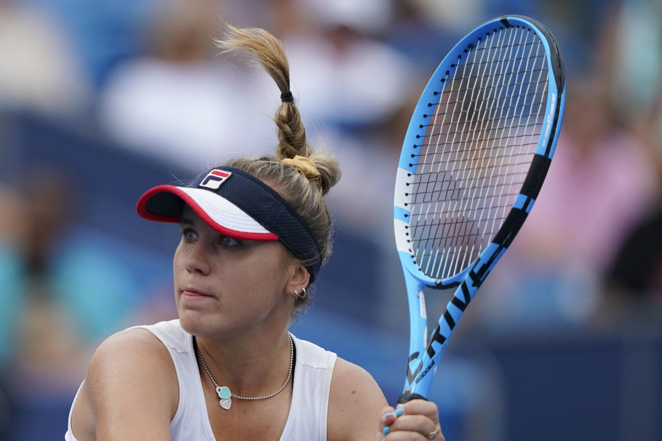 Sofia Kenin, of the United States, returns to Madison Keys, also of the United States, during the Western & Southern Open tennis tournament Saturday, Aug. 17, 2019, in Mason, Ohio. (AP Photo/John Minchillo)