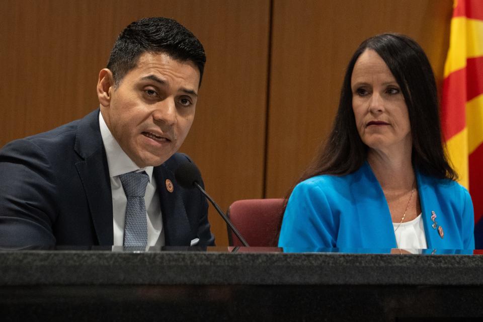 Rep. Steve Montenegro (left) speaks during the Novel Coronavirus Southwestern Intergovernmental Committee event on May 25, 2023, in Senate Hearing Room 1 at the Arizona state Capitol in Phoenix. Looking on is Senator Janae Shamp (right).