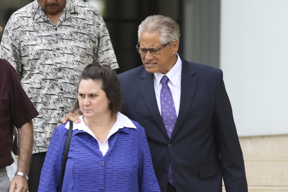 FILE - In this June 25, 2019 file photo, former Honolulu police chief Louis Kealoha, right, and his wife former deputy prosecutor Katherine Kealoha, walk out of federal court in Honolulu. A jury has found the former Honolulu prosecutor and her now-retired police chief husband guilty in a plot to frame a relative to silence him from revealing fraud that financed their lavish lifestyle. The verdict came Thursday, June 27, 2019, in what has been described as Hawaii’s biggest corruption case. (AP Photo/Caleb Jones, file)