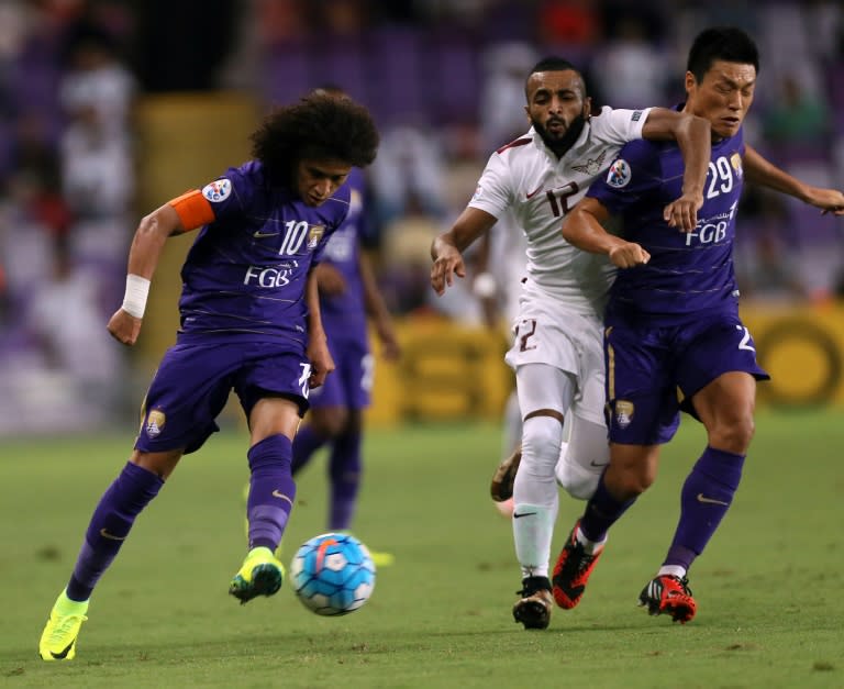 UAE's Al Ain FC player Omar Abdulrahman (L) fights for the ball with Qatar's El Jaish player Magid Mohamed during their AFC Champions League semi-final first leg match, at Hazza Bin Zayed Stadium Al-Ain, on September 27, 2016