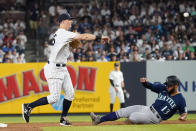 New York Yankees second baseman DJ LeMahieu throws to first to complete a double play after forcing out Seattle Mariners' Abraham Toro (13) during the sixth inning of a baseball game Thursday, Aug. 5, 2021, in New York. Luis Torrens was out at first. (AP Photo/Mary Altaffer)