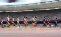 Athletes compete in the men's 5000m round 1 heat during the London 2012 Olympic Games at the Olympic Stadium August 8, 2012.