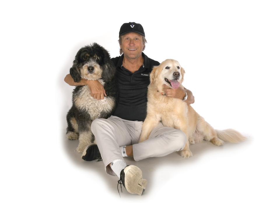 Rick Vlasic, co-founder of Vlasic Labs, sits with Yogi the Bernedoodle, left, and Ozzy the Golden Retriever. Rick Vlasic founded Vlasic Labs with his son, Willy Vlasic, which makes CBD products for people and pets.