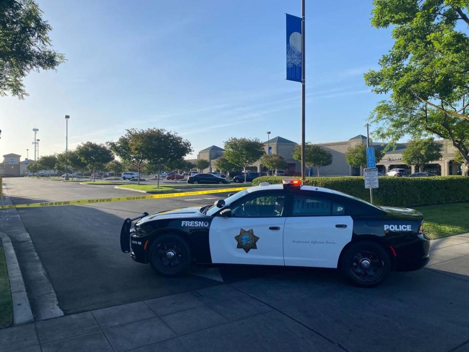 Fresno police at the scene of a standoff with a suspect barricaded inside the Save Mart grocery store near First Street and Nees Avenue on Friday morning, May 20.