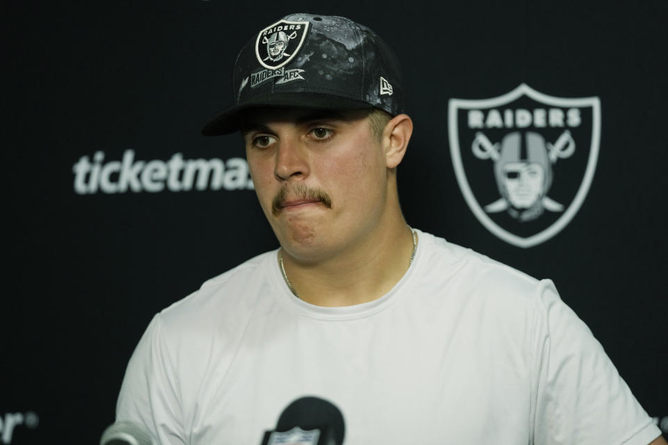 Las Vegas Raiders quarterback Aidan O'Connell (4) speaks during a news conference after an NFL football game against the Miami Dolphins, Sunday, Nov. 19, 2023, in Miami Gardens, Fla. The Dolphins defeated the Raiders 20-13. (AP Photo/Wilfredo Lee)