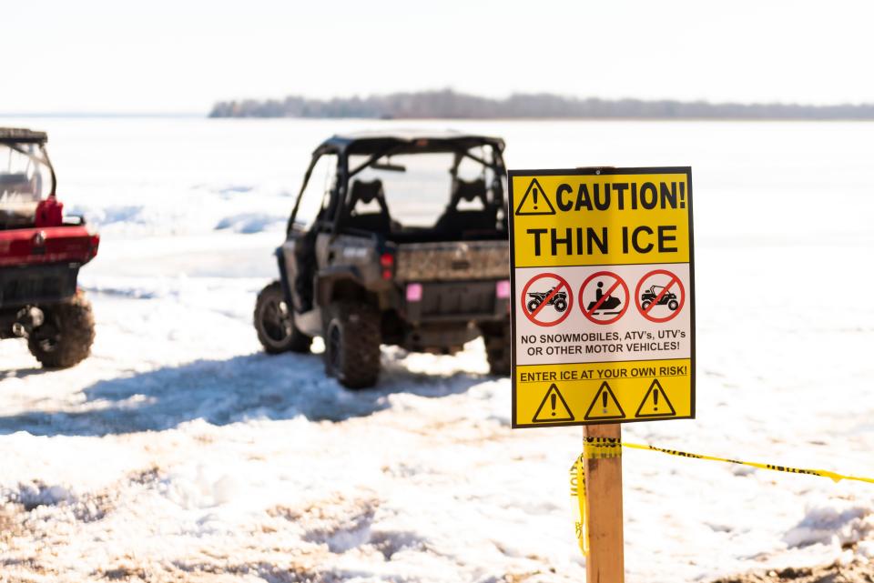 A sign warning people about the dangers of thin ice is displayed at the Black Lake Sturgeon Shivaree on Saturday, Feb. 3, 2024.