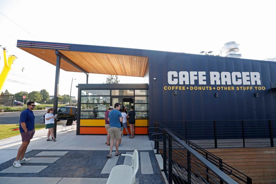People line up for breakfast during the grand opening of Cafe Racer in Athens, Ga., on Tuesday, Aug 22, 2023.