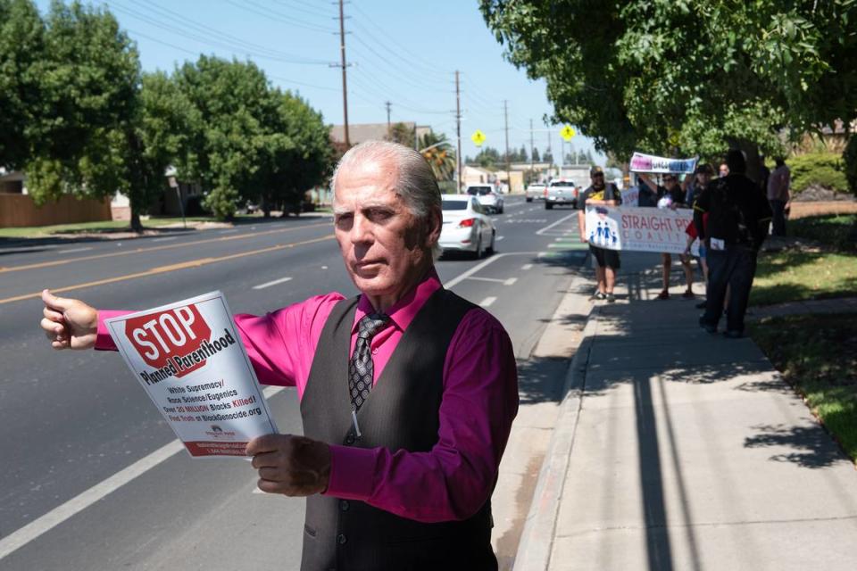 Straight Pride organizer Don Grundmann and other members of his coalition moved their event to Coffee Road in Modesto, Calif., on Saturday, August 27, 2022.