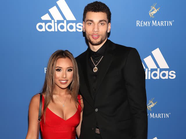 <p>Jerritt Clark/Getty</p> Zach LaVine and girlfriend Hunter Mar attend the Adidas Basketball Black Tie Party.