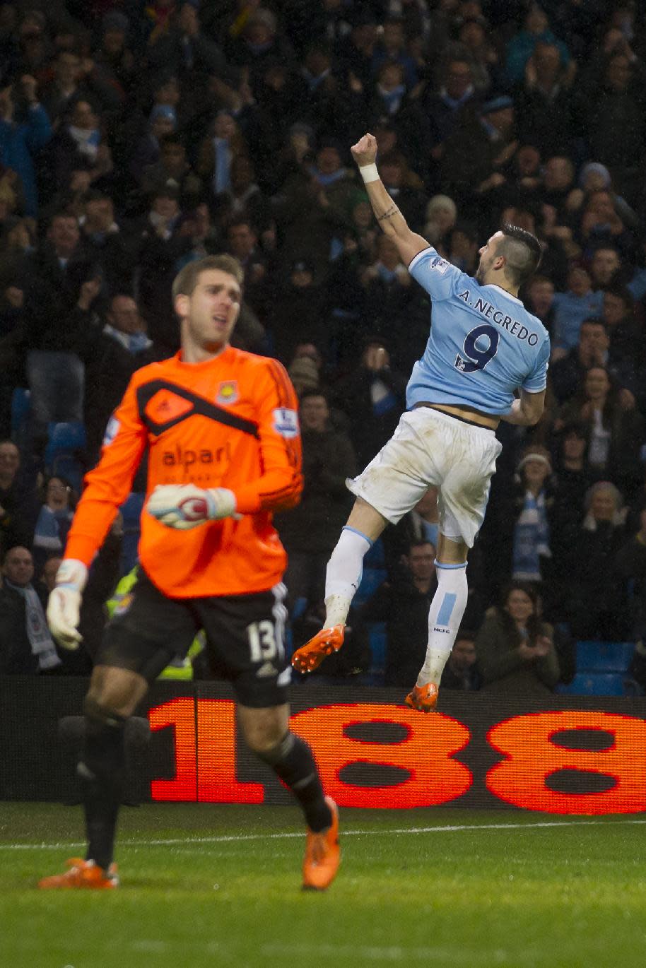 Manchester City's Alvaro Negredo celebrates after scoring his third goal past West Ham's goalkeeper Adrian, left, during their English League Cup semi-final soccer match at the Etihad Stadium, Manchester, England, Wednesday Jan. 8, 2014. (AP Photo/Jon Super)