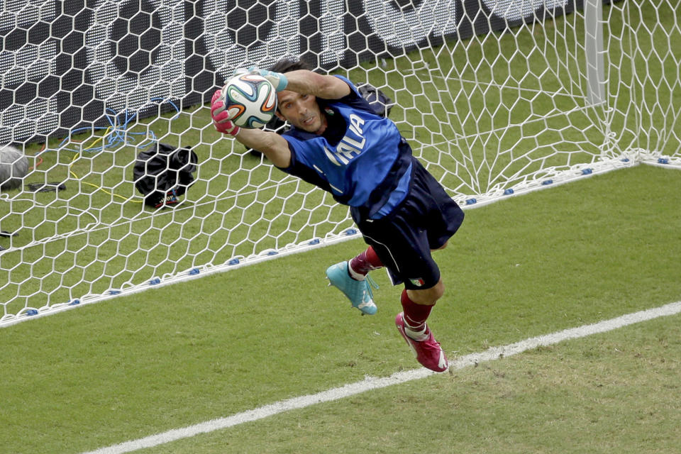 FILE - Italy's goalkeeper Gianluigi Buffon prepares for the group D World Cup soccer match between Italy and Uruguay at the Arena das Dunas in Natal, Brazil, Tuesday, June 24, 2014. At age 45 and after a career that included a World Cup title with Italy, a long list of trophies with Juventus and many years when he was considered among the best goalkeepers in soccer, Gianluigi Buffon announced his retirement on Wednesday, Aug. 2, 2023. (AP Photo/Hassan Ammar, File)