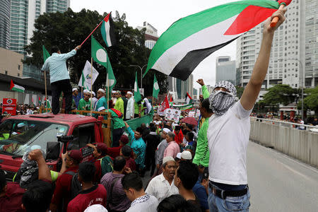 Pro-Palestine protesters march towards the U.S. embassy in Kuala Lumpur, Malaysia December 8, 2017. REUTERS/Stringer