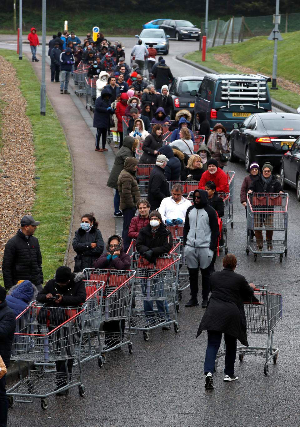 People queue outside of a Costco store in Watford, as the spread of the coronavirus disease (COVID-19) continues, Britain, March 19, 2020. REUTERS/Paul Childs