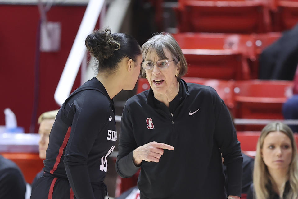 Stanford head coach Tara VanDerveer, right, speaks with Stanford guard Talana Lepolo during a break in action against Utah in the first half of an NCAA college basketball game Saturday, Feb. 25, 2023, in Salt Lake City. (AP Photo/Rob Gray)