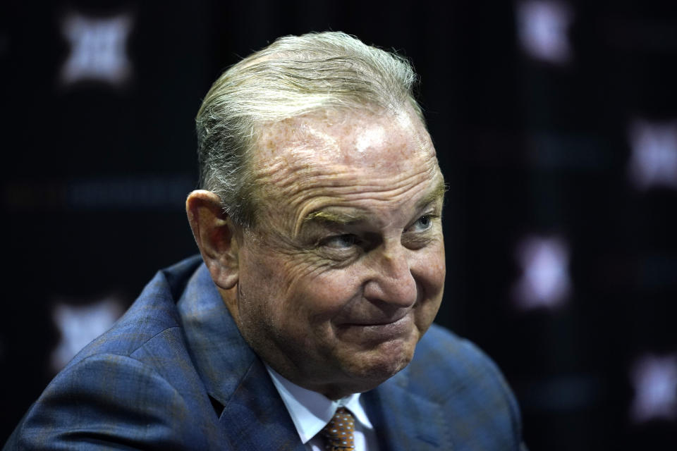 Texas women's head coach Vic Schaefer talks with a reporter during the Big 12 NCAA college basketball media days Tuesday, Oct. 19, 2021, in Kansas City, Mo. (AP Photo/Ed Zurga)