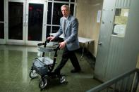 A man pushes out of the courtroom the chair used by film producer Harvey Weinstein after a verdict during the ongoing sexual assault trial of at New York Criminal Court in the Manhattan borough of New York City, New York