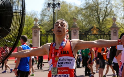 Runner standing in front of a large fan to cool down at the end of the Marathon - Credit: DHF/ZDS