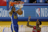 Golden State Warriors guard Mychal Mulder (15) dunks in front of New Orleans Pelicans guard Nickeil Alexander-Walker, right, during the first half of an NBA basketball game on Friday, May 14, 2021, in San Francisco. (AP Photo/Tony Avelar)