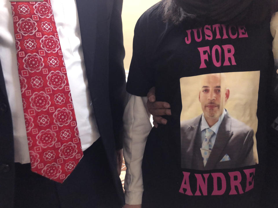 FILE - In this Dec. 31, 2020, file photo, Andre Hill, fatally shot by Columbus police on Dec. 22, is memorialized on a shirt worn by his daughter, Karissa Hill in Columbus, Ohio. Former Columbus Police officer Adam Coy was charged with murder in the shooting death Andre Hill, a Black man. Assistant Attorney General Anthony Pierson filed a motion Wednesday, July 14, 2021, opposing Coy's request for the trial be moved to another county in order to convene a fair and impartial jury. (AP Photo/Andrew Welsh-Huggins, File)