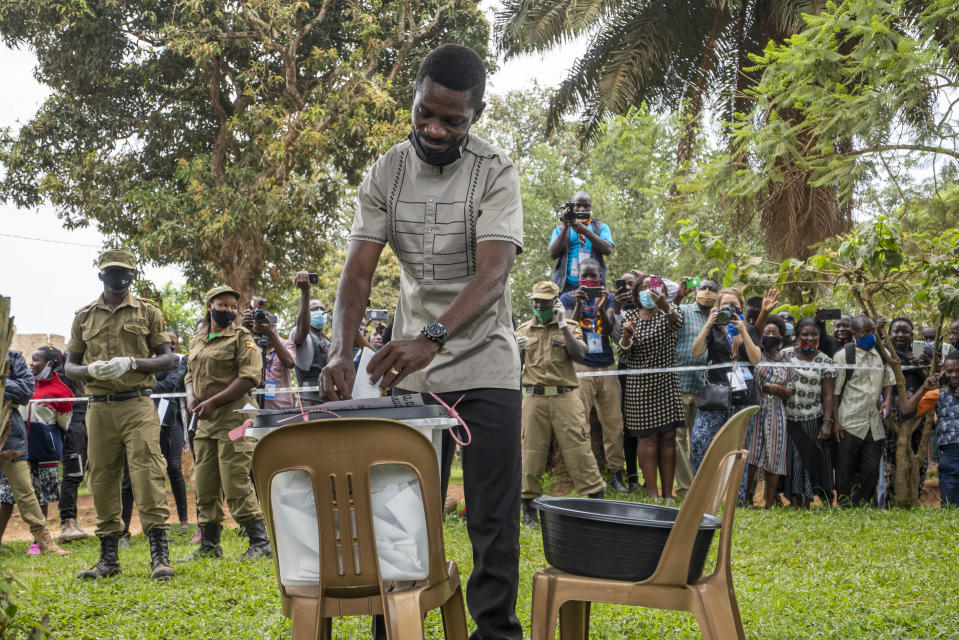 Uganda's leading opposition challenger Bobi Wine votes in Kampala, Uganda, Thursday, Jan. 14, 2021. Ugandans are voting in a presidential election tainted by widespread violence that some fear could escalate as security forces try to stop supporters of Wine from monitoring polling stations.(AP Photo/Jerome Delay)