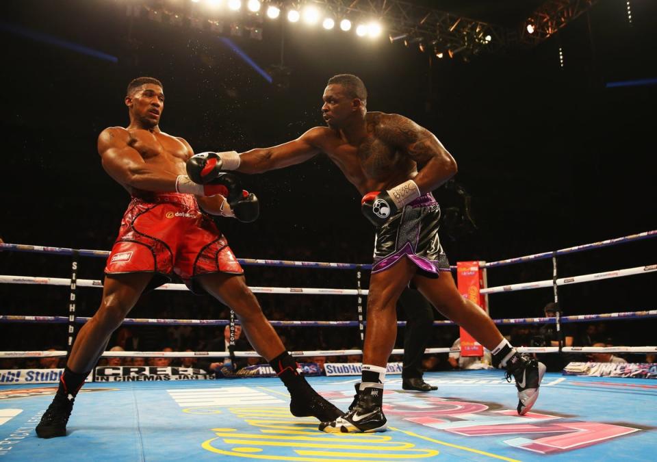 Joshua (left) knocked out Whyte in 2015 to avenge an amateur loss (Getty)