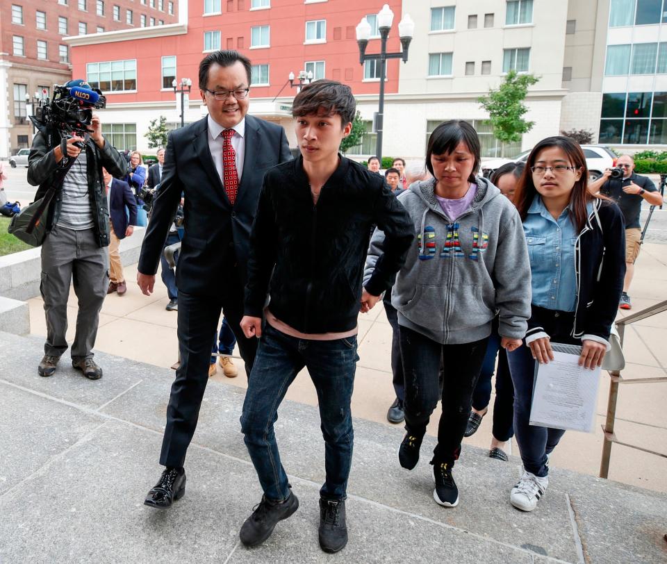 Her mother Lifeng Ye and brother Zhengyang Zhang arrive at the US Courthouse. (AFP/Getty Images)