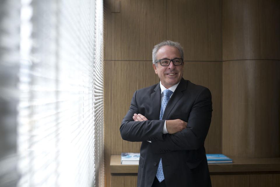 In this Oct. 16, 2018 photo, lawyer Helio Saboya poses for a portrait at his office in Rio de Janeiro, Brazil. Saboya, 58, says he will cast a different kind of protest vote in the Oct. 28 presidential runoff: a blank ballot. “I will throw my vote in the trash because that’s where it belongs in face of these two candidates,” said Saboya. (AP Photo/Beatrice Christofaro)