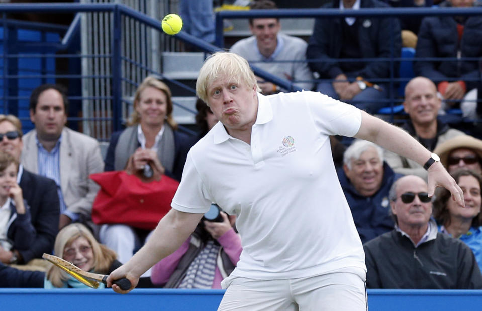 Boris Johnson (centre) takes part in a celebrity tennis match in aid of the Royal Marsden Hospital at The Queen's Club, London. 