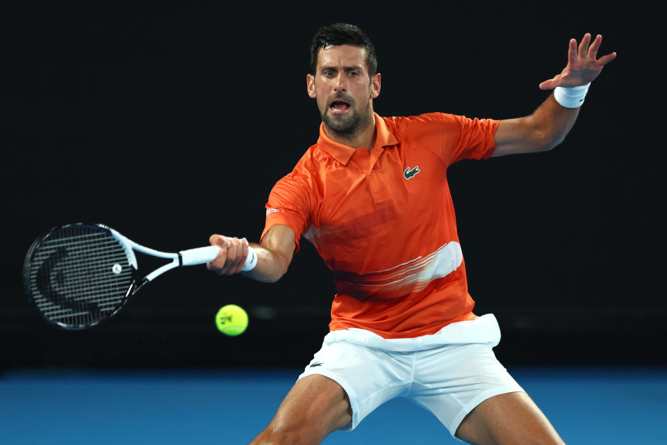 Novak Djokovic plays a forehand in his Arena Showdown charity match against Nick Kyrgios ahead of the 2023 Australian Open. (Graham Denholm/Getty Images)