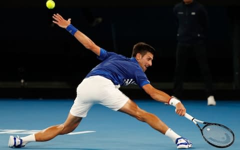 Serbia's Novak Djokovic hits a return against Russia's Daniil Medvedev during their men's singles match on day eight of the Australian Open tennis tournament in Melbourne on January 21, 2019. - Credit: AFP