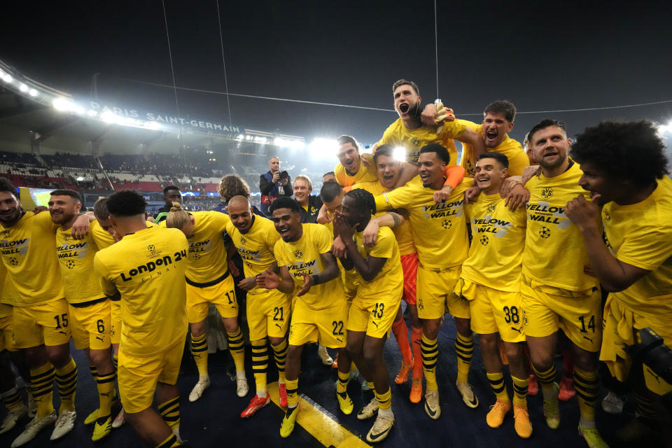 Borussia Dortmund players celebrate at the end of the Champions League semifinal second leg soccer match between Paris Saint-Germain and Borussia Dortmund at the Parc des Princes stadium in Paris, France, Tuesday, May 7, 2024. (AP Photo/Frank Augstein)