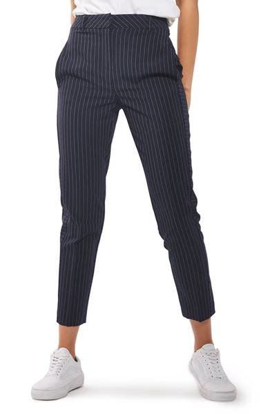 Get them at <a href="https://shop.nordstrom.com/s/topshop-cut-about-pinstripe-cigarette-trousers/4650506?origin=keywordsearch-personalizedsort&amp;fashioncolor=NAVY%20BLUE" target="_blank">Nordstrom</a>, $55.