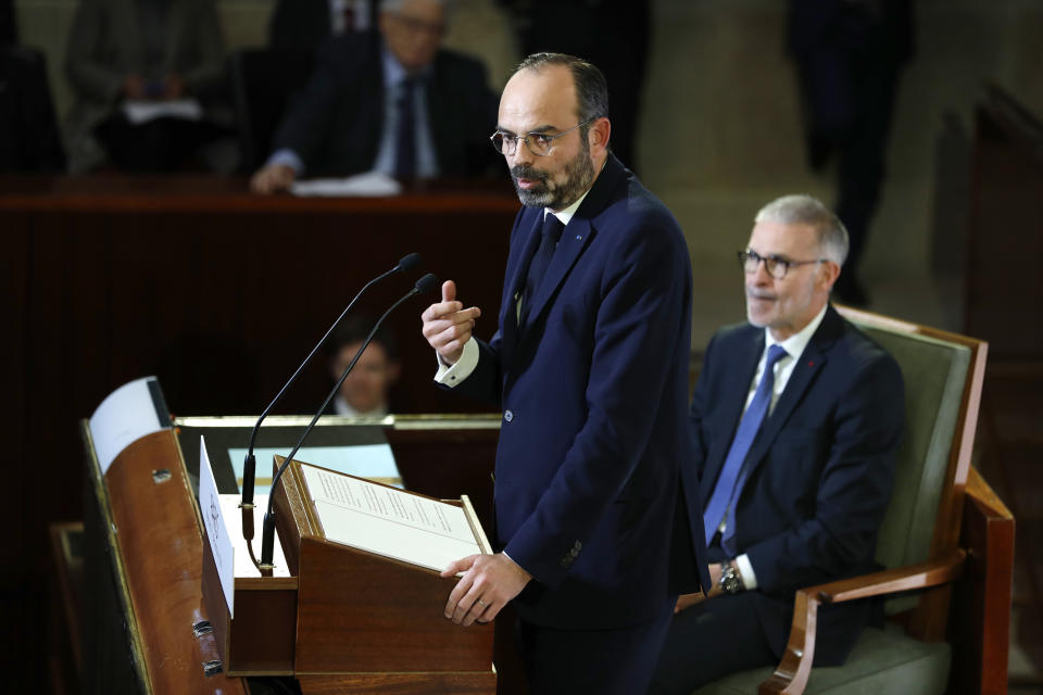 French Prime Minister Edouard Philippe delivers his speech Wednesday, Dec. 11, 2019 in Paris as he unveils proposals on pension reforms that might calm tensions on the seventh straight day of a crippling transport strike. (Thomas Samson/Pool via AP)