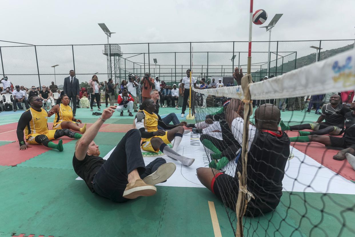 Britain's Prince Harry takes part in an exhibition sitting volleyball match at Nigeria Unconquered. This local charity organization supports wounded, injured, or sick servicemembers, in Abuja on May 11, 2024, as they visit Nigeria as part of celebrations of Invictus Games anniversary.