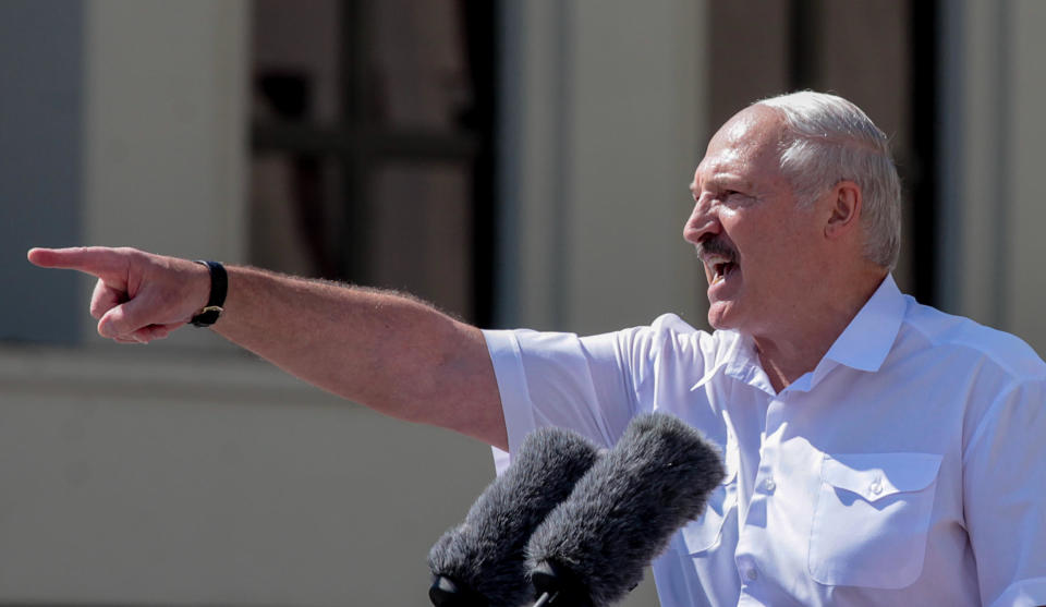 Belarus' President Alexander Lukashenko gestures as he delivers a speech during a rally held to support him in central Minsk, on August 16, 2020. / Credit: SIARHEI LESKIEC