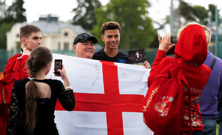 Soccer Football - World Cup - England Training - Saint Petersburg, Russia - June 13, 2018 England's Dele Alli poses for a picture with fans REUTERS/Lee Smith