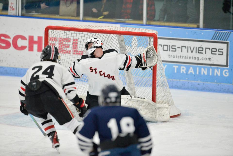 St. Cloud's goalie Hank Bulson stretches out to record a save against Bemidji at the MAC on Saturday, Nov. 27, 2021. 