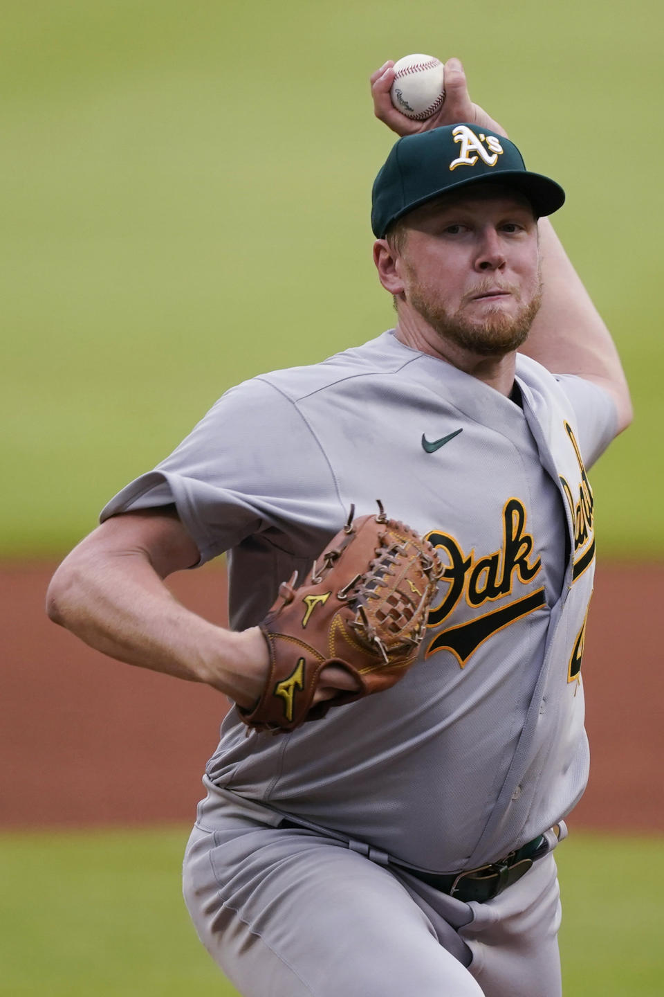 Oakland Athletics pitcher Jared Koenig, making his debut in the majors, throws during the first inning of the team's baseball game against the Atlanta Braves on Wednesday, June 8, 2022, in Atlanta. (AP Photo/John Bazemore)