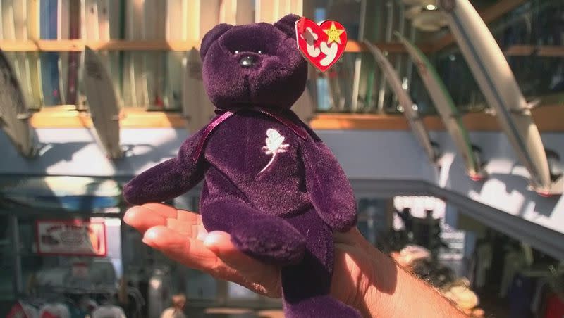 A Princess Diana commemorative Beanie Baby is displayed by employee Joe Toohey at Ron Jon Surf Shop in Cocoa Beach, Florida, on Tuesday March 3, 1998. Apple TV’s latest release, “The Beanie Bubble,” explores how Ty Warner created his Beanie Baby empire.