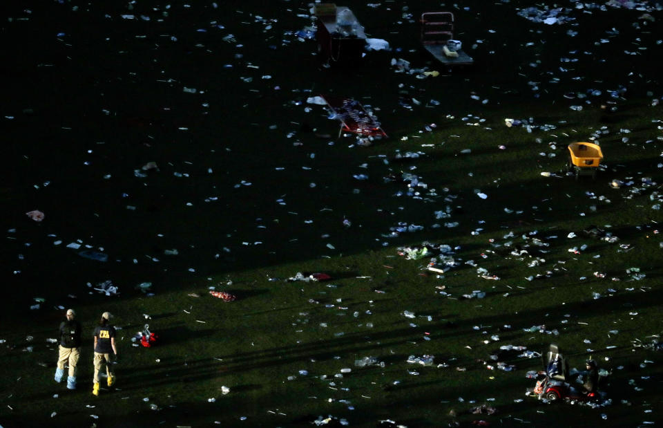 <p>Agents from the FBI continue to process evidence at the scene of a mass shooting as night begins to set on Wednesday, Oct. 4, 2017, in Las Vegas. (Photo: Gregory Bull/AP) </p>