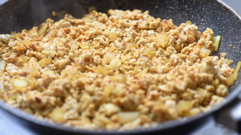 Ground meat in pan with onions